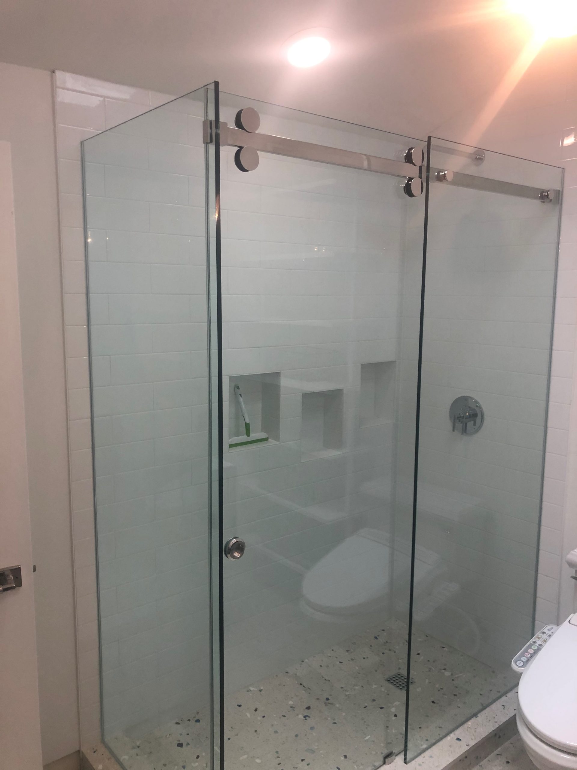 Barn-style sliding glass shower door installation